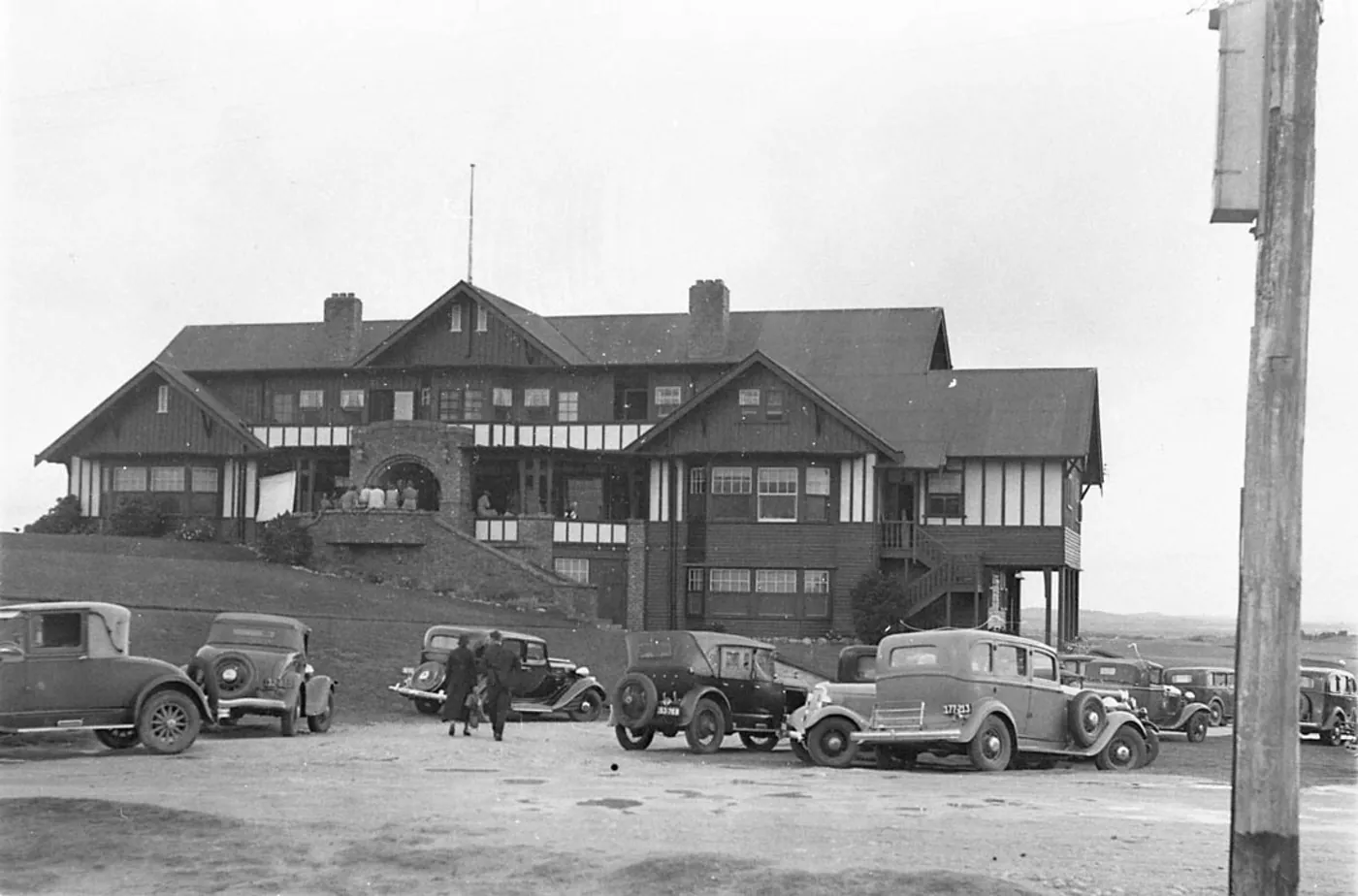 Black-and-white photo of the newly built Barwon Heads Golf Club clubhouse in the 1930s, with period cars out the front