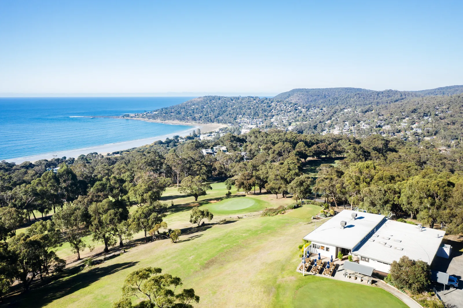 Aerial view of Lorne Country Club with Lorne and the coast behind