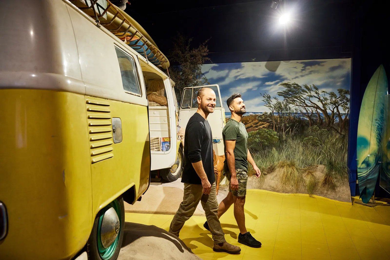 Visitors walking past a vintage Kombi van at the Australian National Surfing Museum