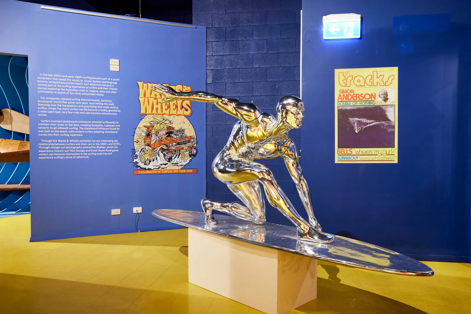 A chrome surfer statue among the displays at the Australian National Surfing Museum