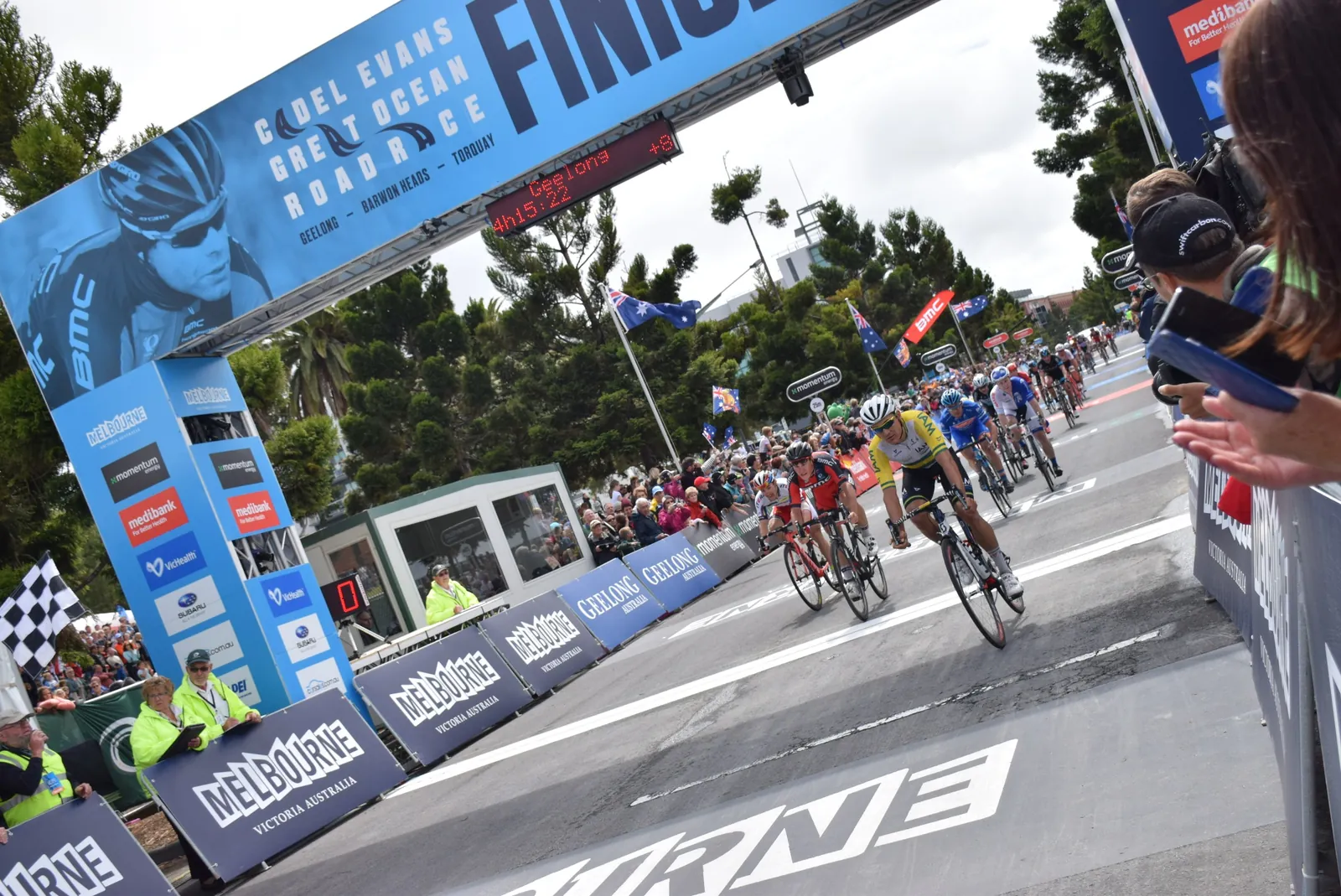 Riders sprinting under the finish arch of the 2015 Cadel Evans Great Ocean Road Race, Geelong