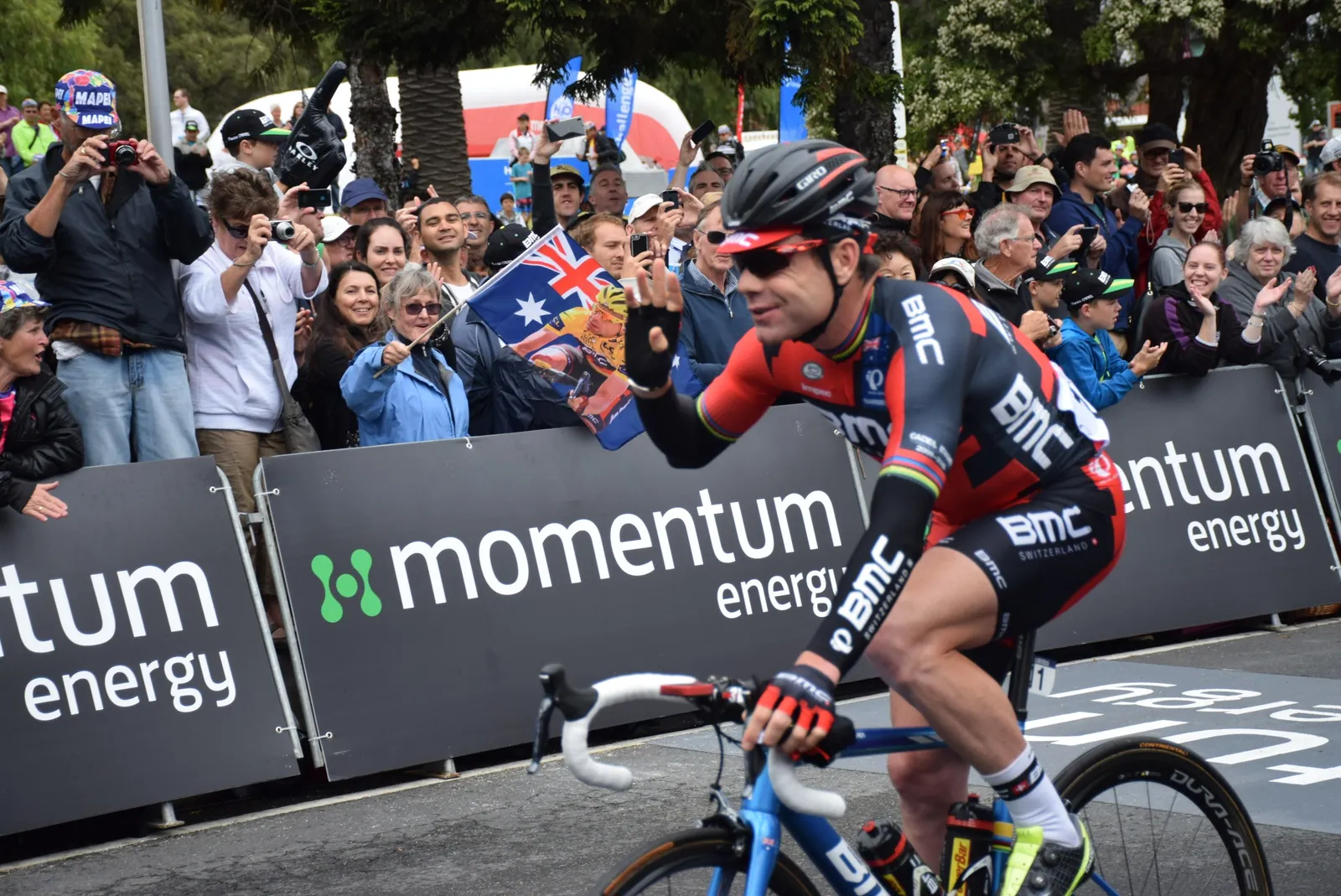 Cadel Evans riding past cheering crowds at his farewell race, the 2015 Cadel Evans Great Ocean Road Race