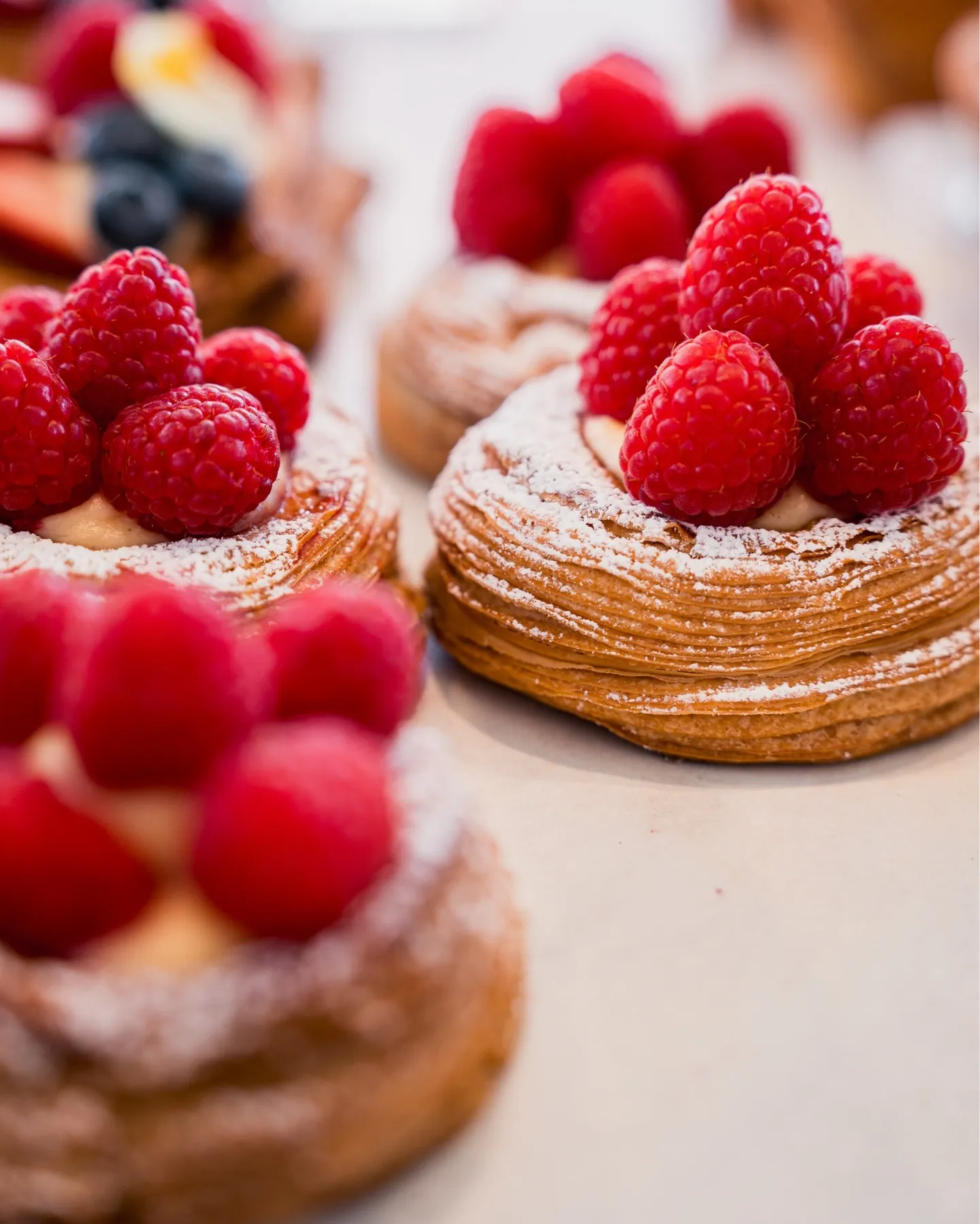 Danishes topped with fresh raspberries