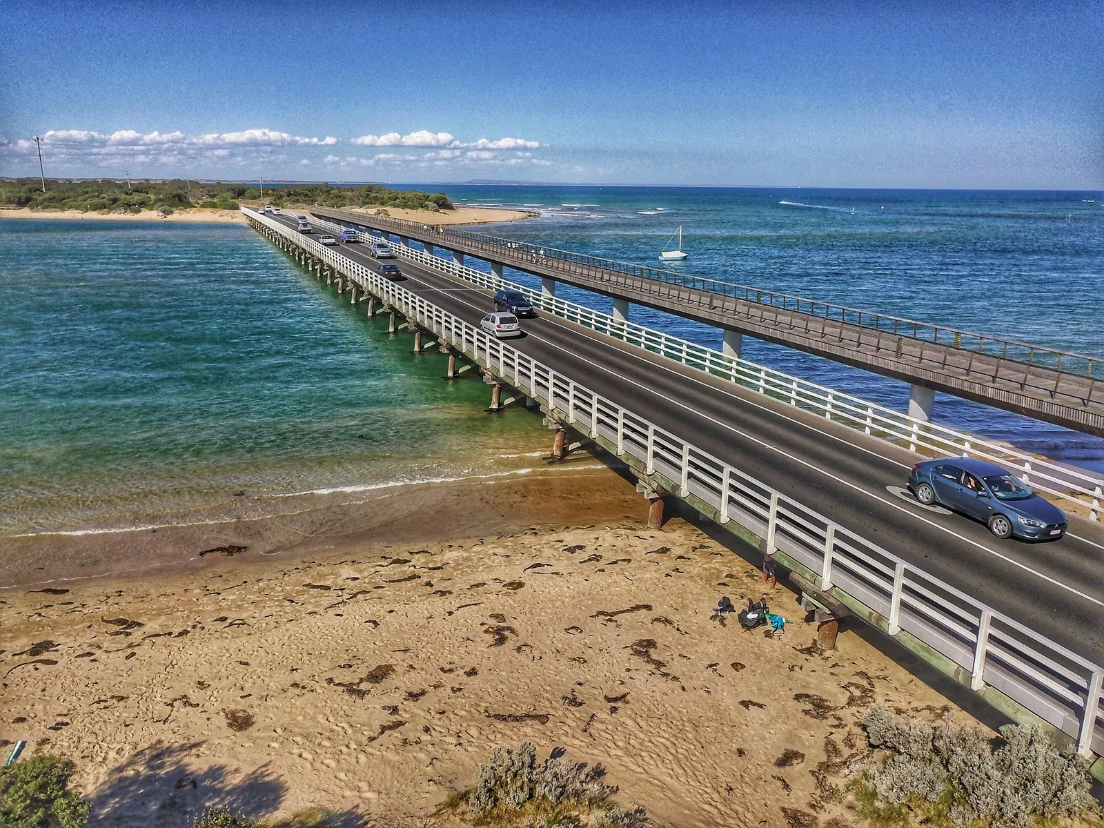 An aerial view of the Barwon River running out into Bass Strait at Barwon Heads