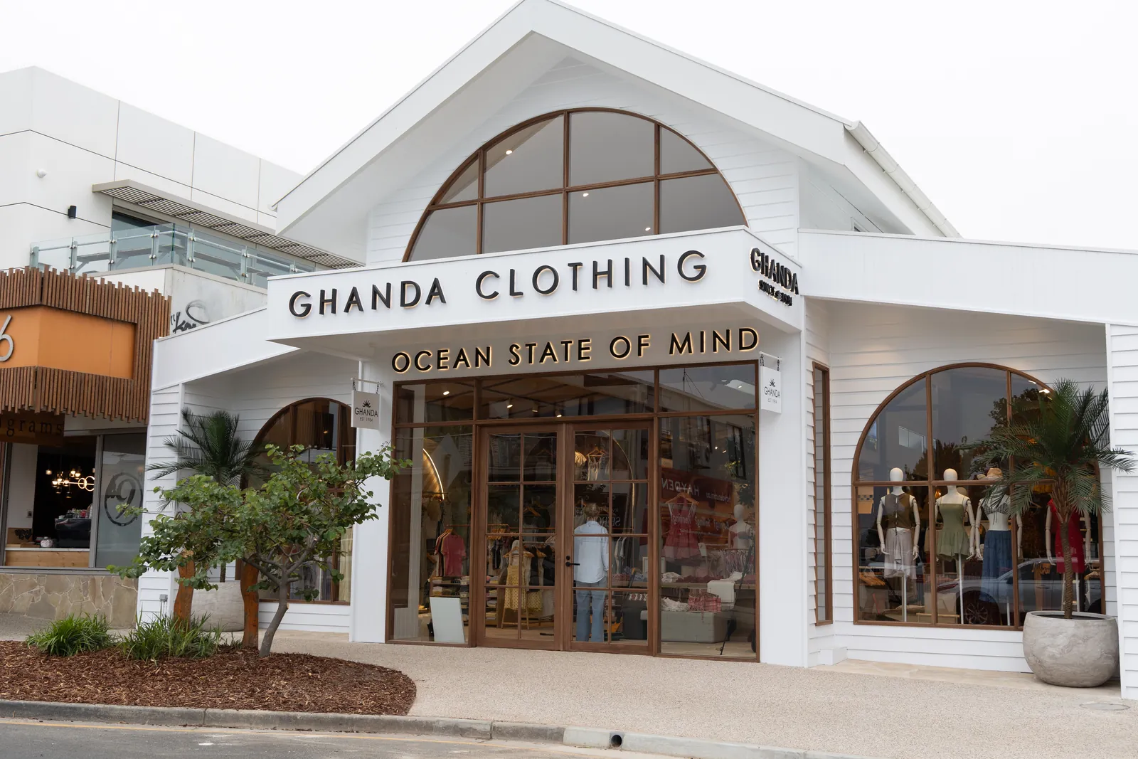 The white weatherboard front of the Ghanda flagship store on Gilbert Street, Torquay, with its arched windows