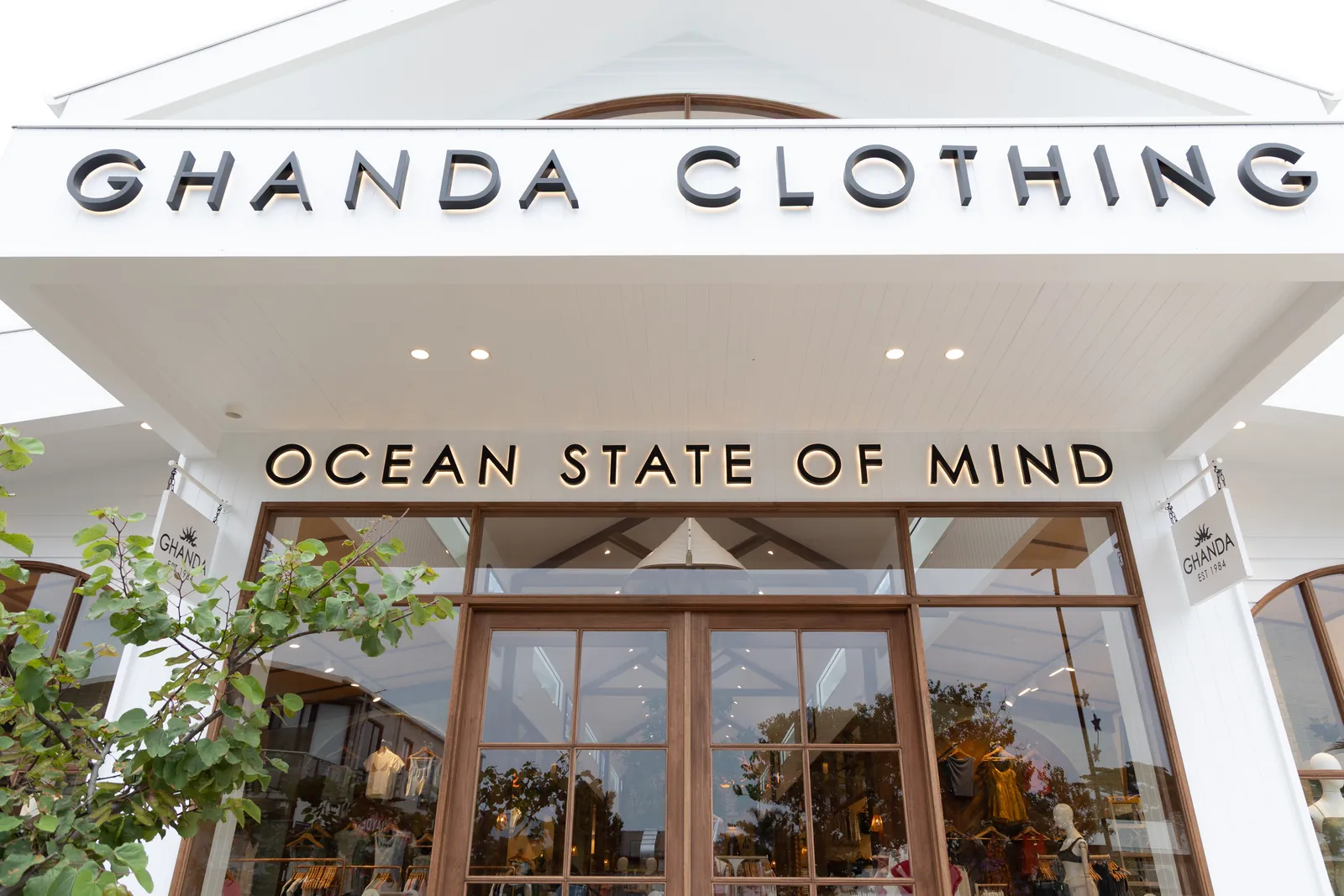 The Ghanda Clothing and Ocean State of Mind signs above the front doors of the Gilbert Street store