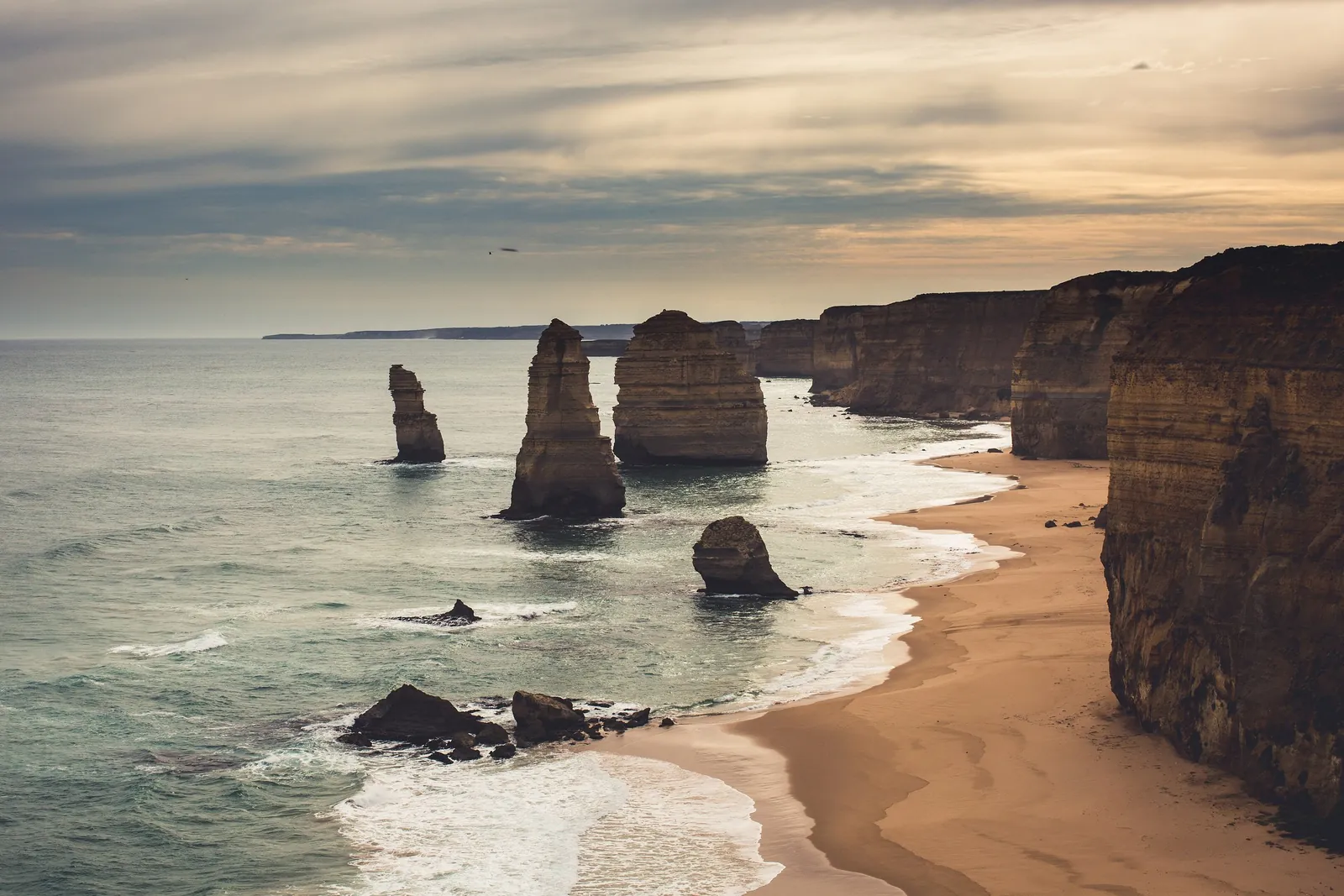 The Twelve Apostles in soft evening light along the Great Ocean Road