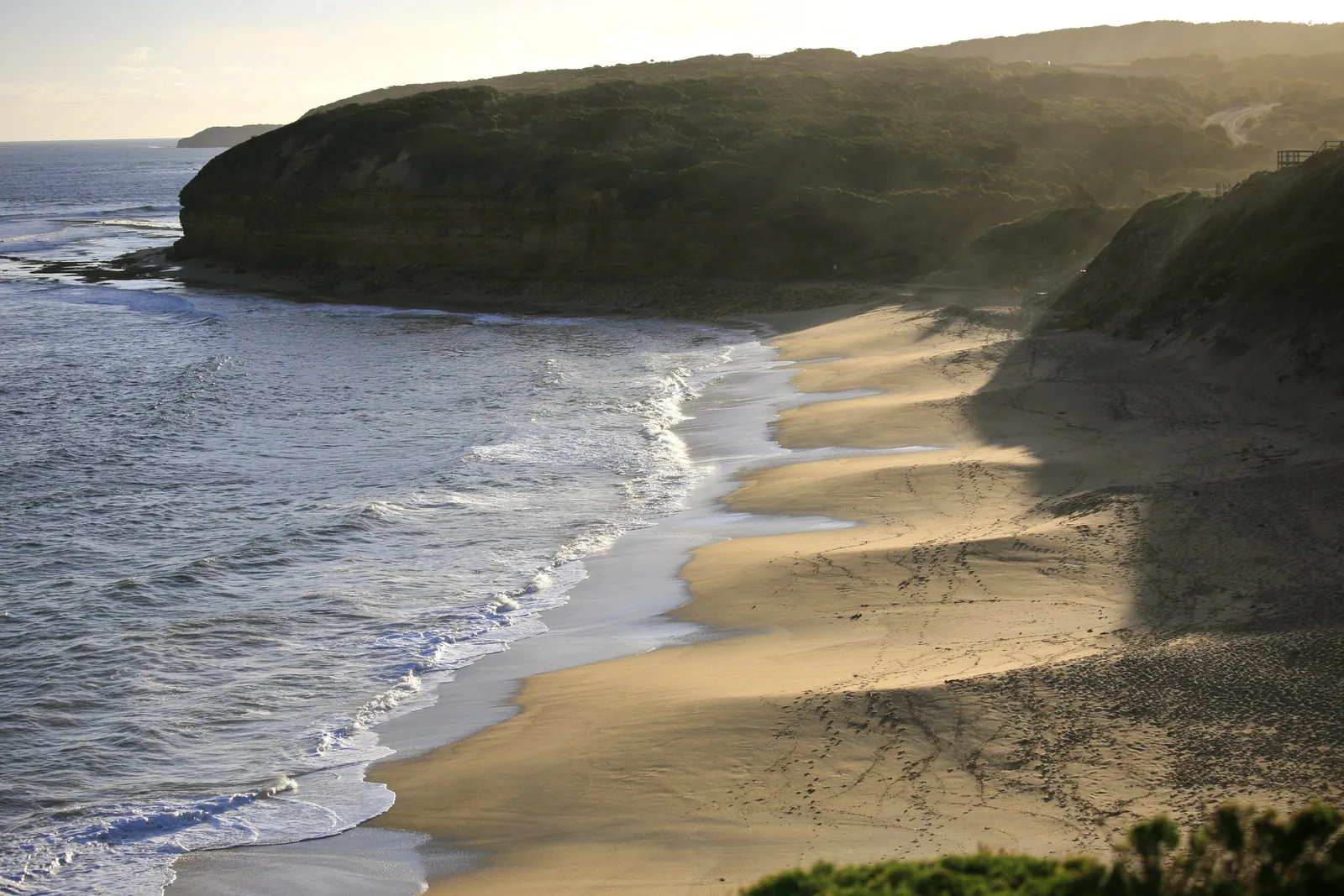Late light on the sand and sandstone cliffs at Bells Beach