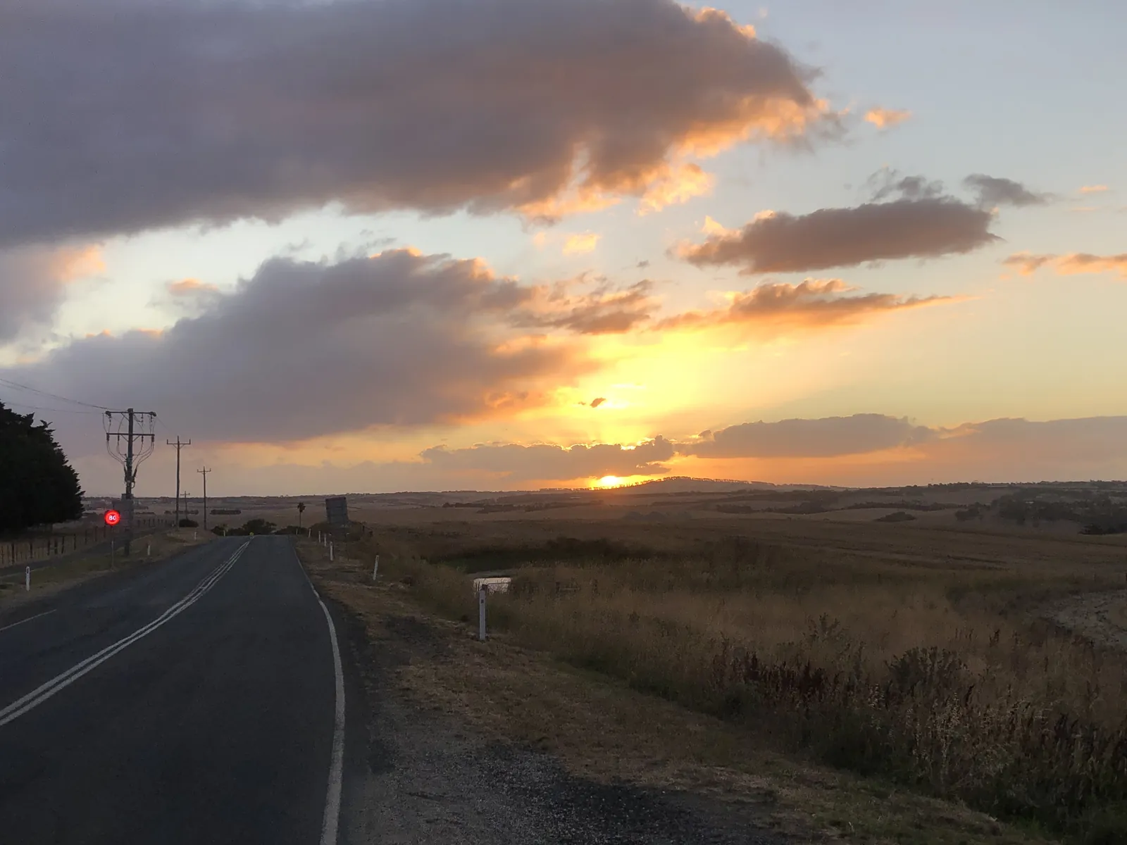 Sunset over farmland and a country road in the Barrabool Hills, west of Geelong