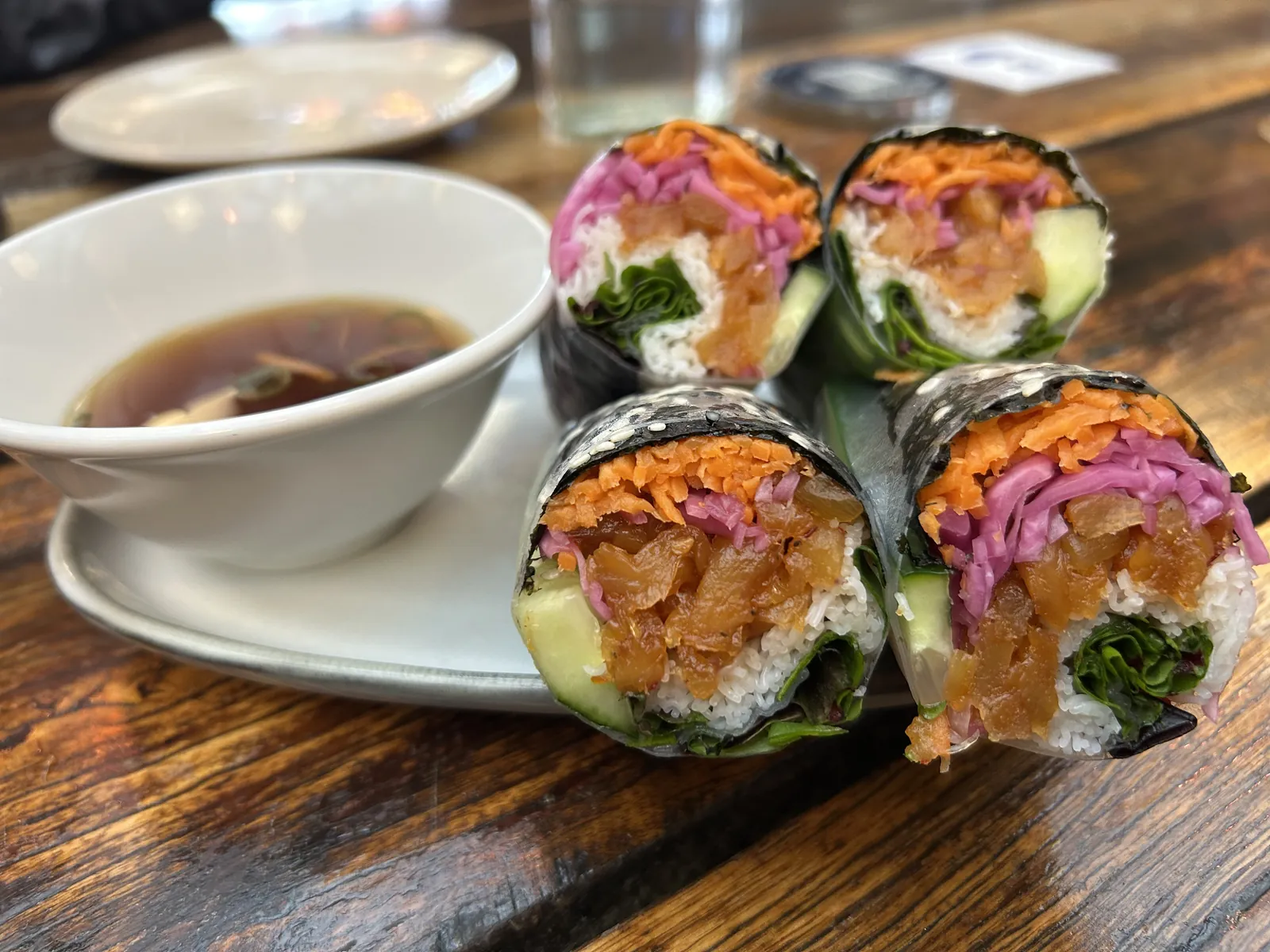 Spiced pineapple rice paper rolls with a dipping sauce at Pholklore, Torquay