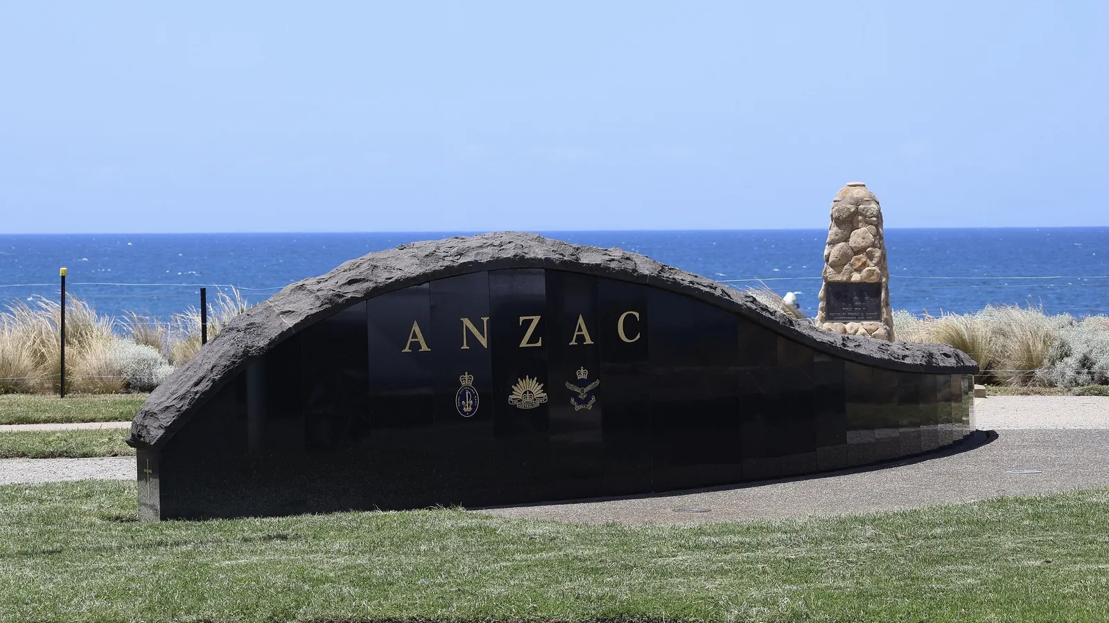 The curved black granite ANZAC memorial at Point Danger, Torquay, overlooking Bass Strait
