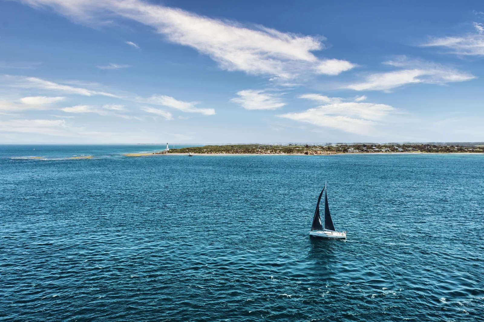 A sailboat on the bay off Point Lonsdale