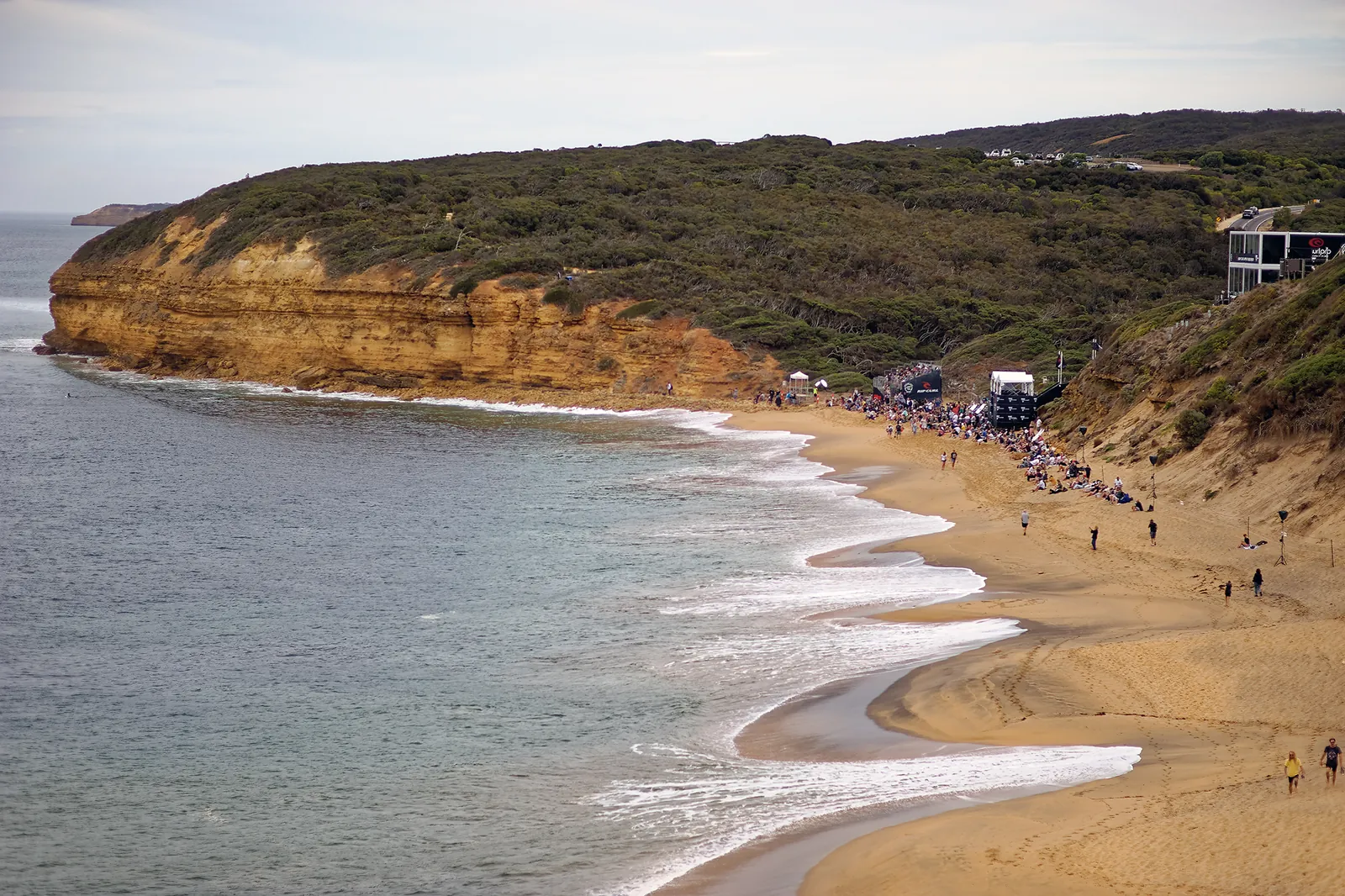 Crowds lining the sand and cliffs at Bells Beach during the 2019 Rip Curl Pro