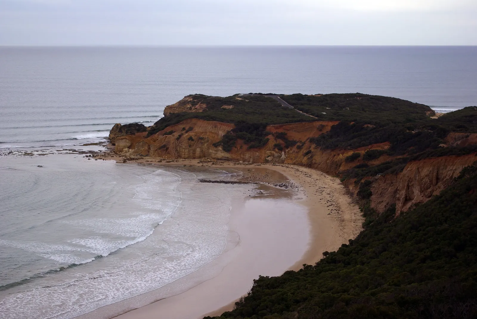 Point Addis and its curving beach seen from the top lookout on the Surf Coast Walk