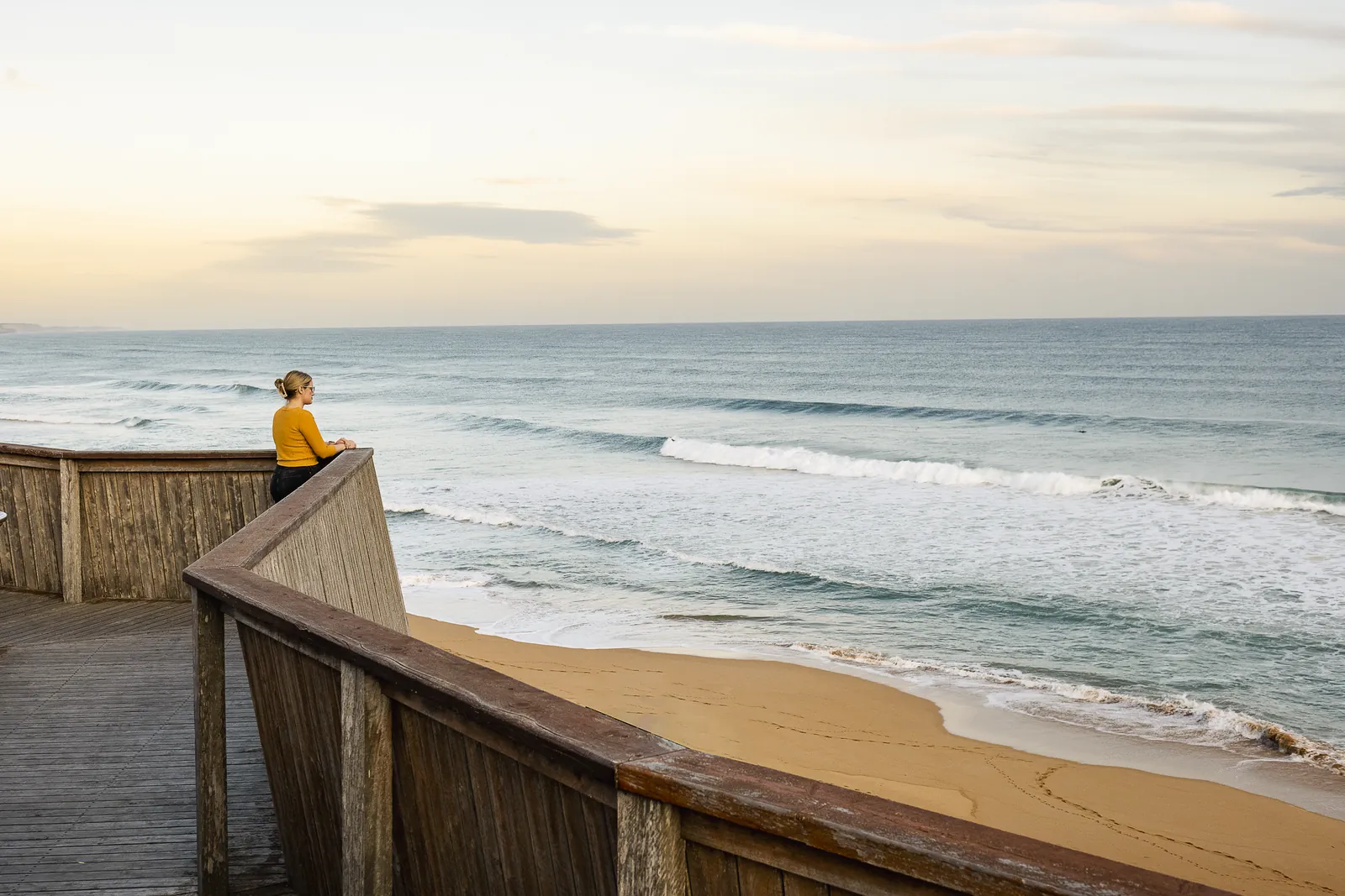 A visitor on the Logan's Beach whale watching platform in Warrnambool