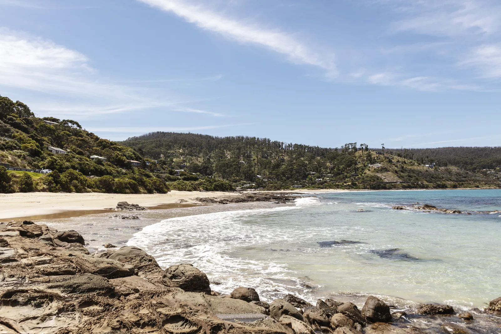 A wide view across the beach and rocky headland at Wye River