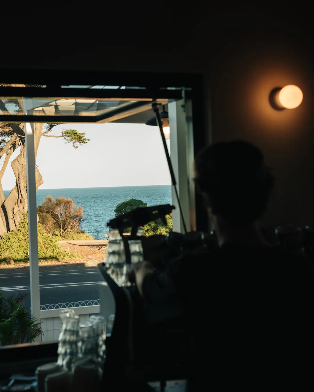 The view through a Bomboras window to the sea late in the day