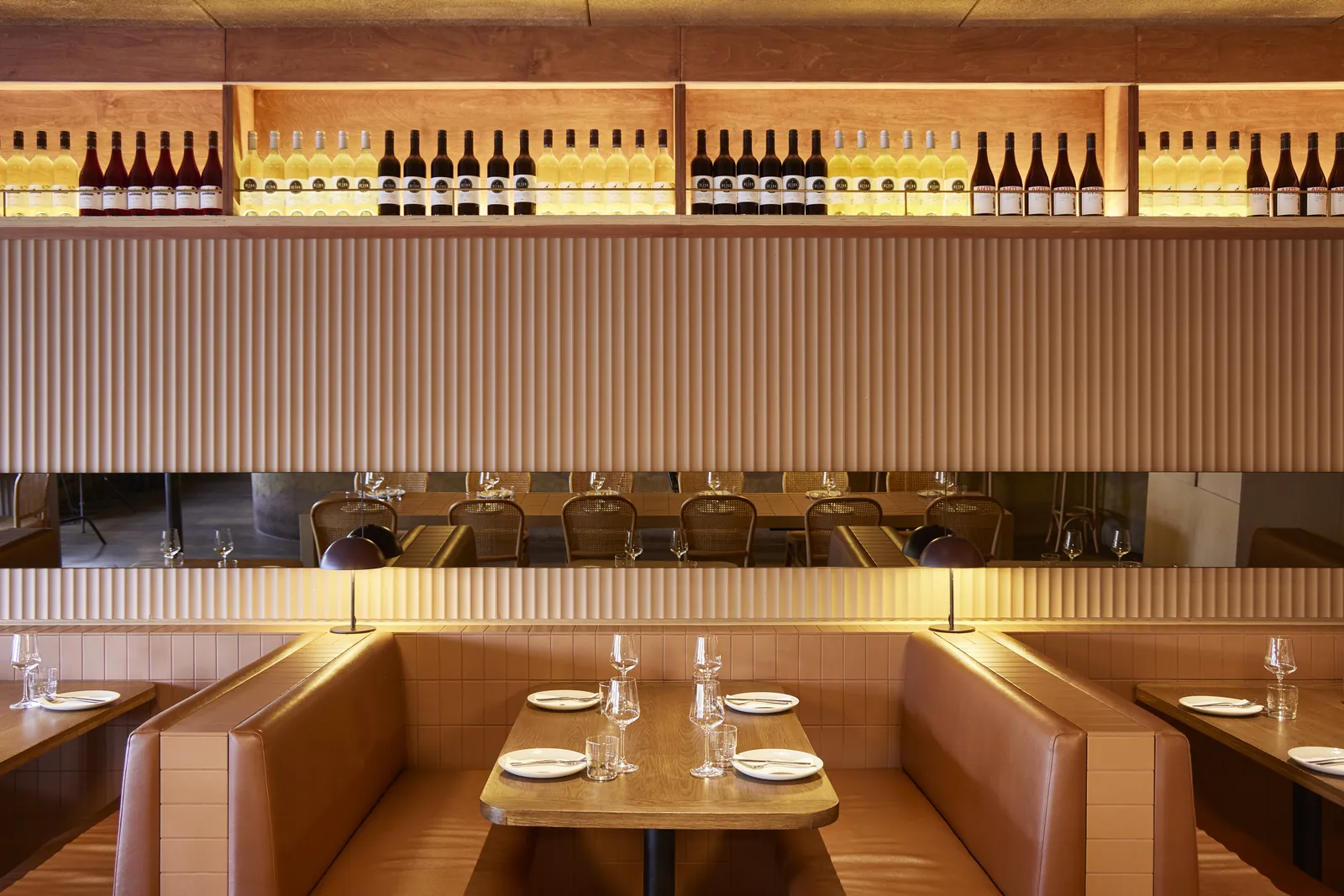 Leather booths and a wine wall in The Kyn's dining room, Torquay