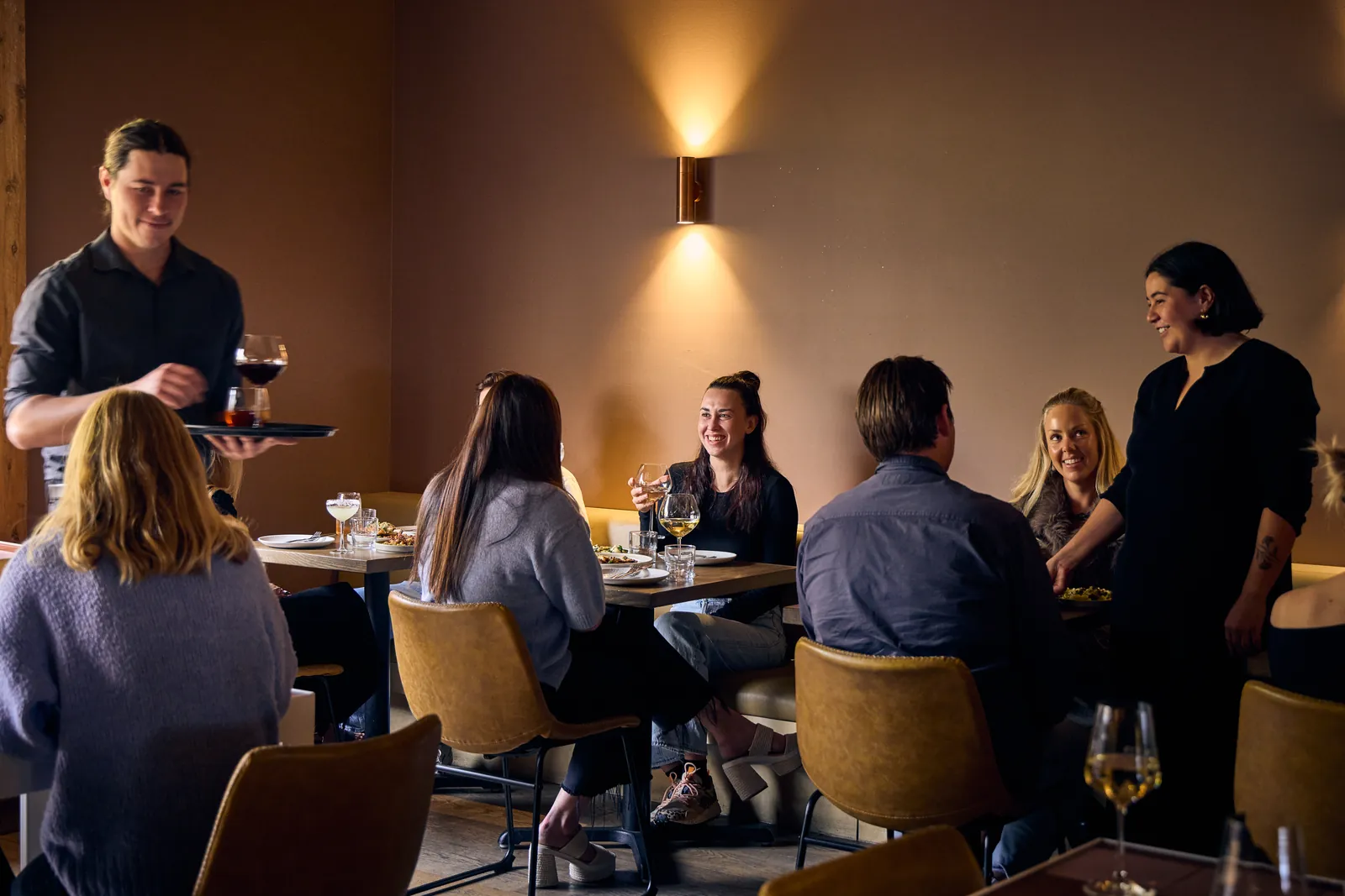 Staff serving diners in The Kyn's dining room
