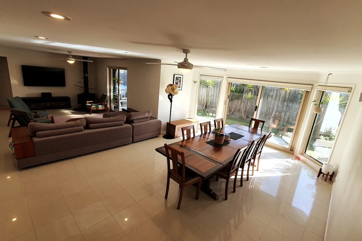 Spacious main living room with wood fire at Holyday House Torquay